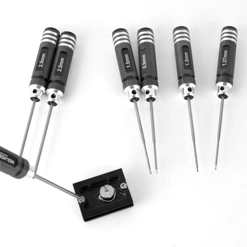 Pro Grade 7 Piece Precision RC Hex Screwdriver Set with 0.9mm to 3.0mm steel tips for RC cars, drones, and helicopters in use.