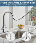 Hurran Kitchen Sink Faucet with Pull Down Sprayer, Brushed Nickel, shown in use pouring water into a pitcher.