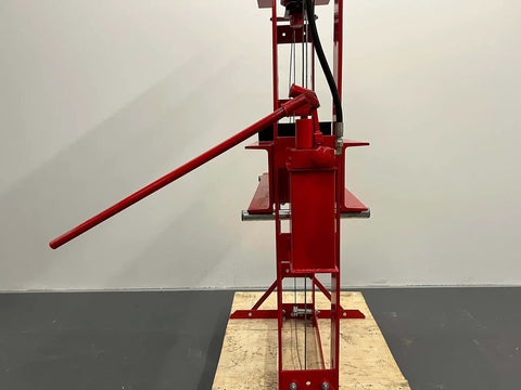 Heavy Duty High Capacity Dual Speed Hydraulic Shop Press providing smooth fast and slow pump action, red steel construction.