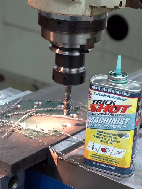 Machinist Drill And Tap Cutting Fluid With A Bio Based Formula That Slashes Friction And Extends Tool Life On Steel Aluminum Copper And More Made In The USA NSF H1 Food Grade Safe For Metalworking Tools 8 Oz next to a CNC machine in use