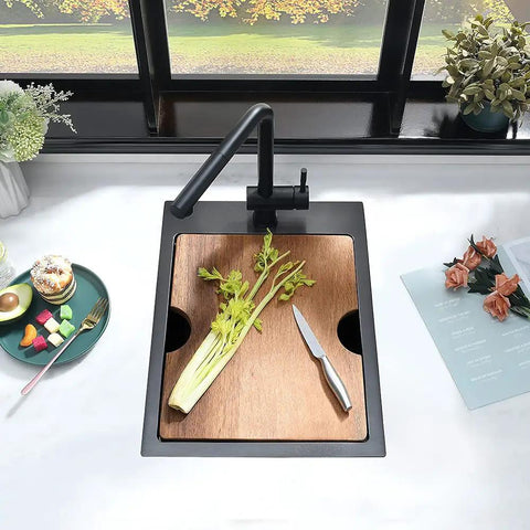 15 Inch Drop-In Bar Sink Workstation With Solid Wood Cutting Board, 16 Gauge Stainless Steel Single Bowl, Outdoor RV Kitchen Prep Sink For Small Spaces, Durable Stainless Bar Basin With Prep Surface in use with celery and knife on board.