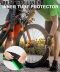 Bike Tire Liner Inner Tube Flat Protector installation on a mountain bike, showcasing black and green liner