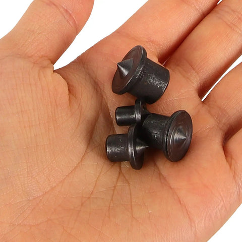Hand holding 8 Pack Steel Dowel Centers For Woodworking Alignment Pins And Dowel Transfer Tools For Precise Cabinet Assembly