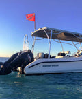 Boat displaying Warning Flag With Removable Stiffening Pole 20x24 Inches Red and White Nylon Dive Flag for scuba gear use