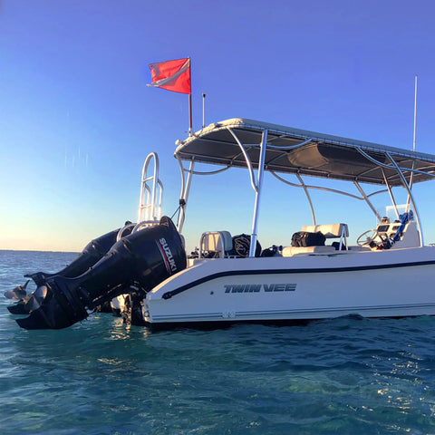 Boat displaying Warning Flag With Removable Stiffening Pole 20x24 Inches Red and White Nylon Dive Flag for scuba gear use