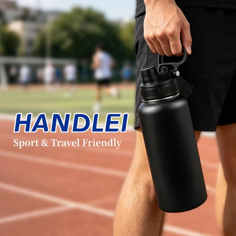 Bulk 8 Pack 32 Oz Double Wall Vacuum Insulated Stainless Steel Water Bottle With Leak Proof Flip Lid And Tote Handle, black stainless steel bottle with carry handle in outdoor setting.