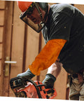 Man using chainsaw wearing Heavy Duty Cowhide Welding Arm Sleeves Heat Resistant Flame Retardant Full Coverage Arm Protectors.