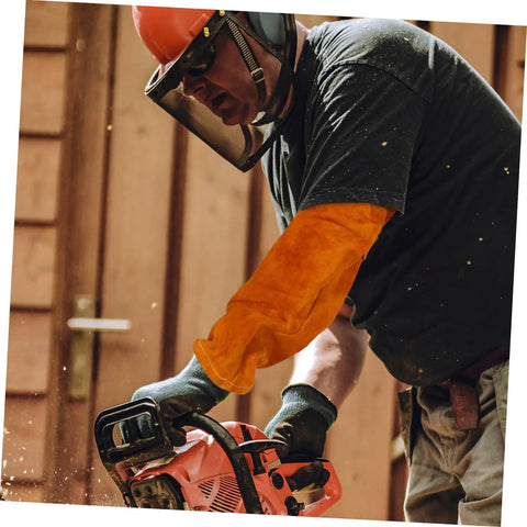 Man using chainsaw wearing Heavy Duty Cowhide Welding Arm Sleeves Heat Resistant Flame Retardant Full Coverage Arm Protectors.