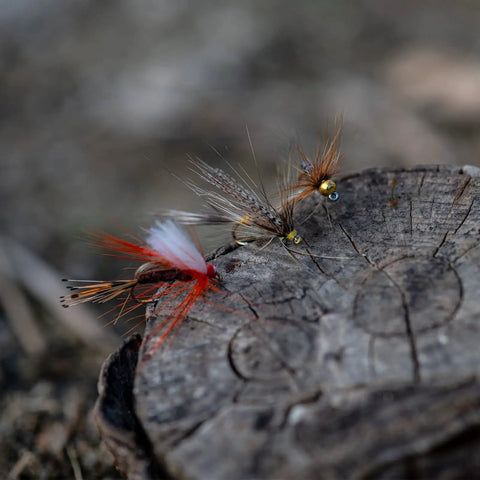 Close-up of hand-tied nymph and streamer flies on wood from 30 Piece Fly Fishing Lure Kit Hand Tied Dry Wet Streamers And Nymph Flies