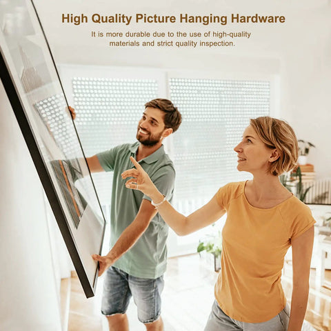 Couple using Heavy Duty Picture Hanging Kit For Walls Handles Up To 100 Lbs With Tough As Nails Wire to hang large frame