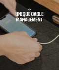 Close-up of a hand connecting a cable to a phone, showcasing the No Fuss Under Desk Slide Out Drawer With Lockable Metal Organizer And Smart Cable Routing For Clean Home Office Setup Matte Black Heavy Duty Carbon Steel Console.
