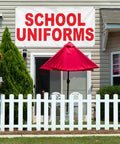 Industrial Grade Custom Printed Heavy Duty Vinyl Banner 24x48 Inches Red Education Design above outdoor seating with a white fence.