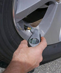 Digital Tire Pressure Gauge With Bright LCD Display And Lighted Tip For Night Checks No Fluff Easy Read 5 To 150 PSI Fast Accurate Readouts Long Battery Life Replacement Battery Ready Great For Cars And SUVs in hand on car tire valve