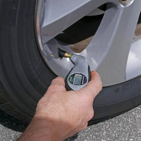 Digital Tire Pressure Gauge With Bright LCD Display And Lighted Tip For Night Checks No Fluff Easy Read 5 To 150 PSI Fast Accurate Readouts Long Battery Life Replacement Battery Ready Great For Cars And SUVs in hand on car tire valve