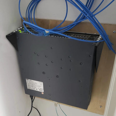 Straight Up Heavy Duty 2U Hinged Wall Mount Patch Panel Bracket Vertical Rack For 19 Inch Server Racks And Network Switches mounted with cables