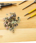 50 Pack Of Straight Up Solid Iron Captive Nut Fasteners With Top Shelf License Plate Screw Retainer Clips on wood surface.