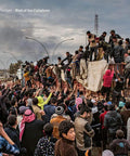 End of the Caliphate Gritty Raw on the Ground Mosul War Photo Book from New York Times Photographer Documenting Battle to Reclaim Iraqs Second City from ISIS Vivid Front Line Shots showing a crowd in Mosul.