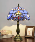 Blue Baroque Tiffany Style Stained Glass Table Lamp For Bedroom And Living Room, 12x12x18 Inch, on a wooden desk.