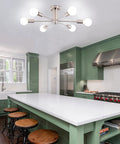 Six Light Nickel Sputnik Ceiling Chandelier With Mid Century Style in modern kitchen above island with green cabinetry.