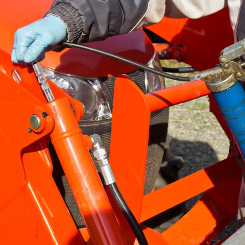 Using Grease Gun Accessory Kit That Hooks You Up With 18 Inch Spring Flex Hose Normal Coupler And Double Handle Quick Lock Release Coupler Tips Nozzles For All One Eighth Inch NPT Grease Gun Adapter Fittings Ten Thousand PSI on vehicle maintenance
