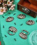 Six Piece Antique Drawer Pulls Set With 1.9 Inch Oval Alloy Cabinet Handles Bronze Finish, Vintage Dresser Knobs With Screws, Retro Charm For Furniture Wardrobe Nightstand Cupboard displayed with screws and a box on a teal background