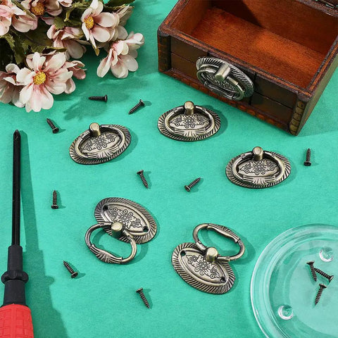 Six Piece Antique Drawer Pulls Set With 1.9 Inch Oval Alloy Cabinet Handles Bronze Finish, Vintage Dresser Knobs With Screws, Retro Charm For Furniture Wardrobe Nightstand Cupboard displayed with screws and a box on a teal background