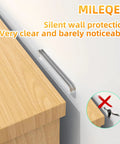 Pack Of Ten Clear Anti Slam Door Bumpers Silent Adhesive Wall Stoppers For Kitchen Cabinets Bedrooms And Closets, shown between cabinet and wall.