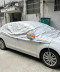 Top Tier Waterproof Car Cover Keeps Your Tesla Cybertruck Whip Looking Sharp And Safe From Road Grime Daily Weather And Sun Damage With A Heavy Canvas Shield And Tight Seal on a white car.