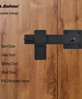 6 Inch Barn Door Flip Latch For Fence And Shed Gates Heavy Duty Solid Metal Iron Hardware In Matte Black installed on a wooden gate
