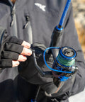 Angler holding Centron Spinning Reel Size 500 with Ultra Smooth Drag Up To 17.5 Lbs, CNC Machined Aluminum Spool, outdoors