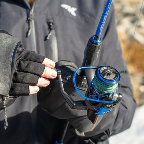 Person holding fishing rod with 3000 Size Spinning Reel With Ultra Smooth Drag Up To 17.5 Lbs, CNC Aluminum Spool, in fishing glove