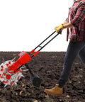 Person using Hand Push Roller Seeder Manual Seeder Machine Walk Behind Row Crop Planter with five mouths on field