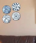 Adjustable Wall Plate Hanger Display Holder For 7 To 14 Inch Plates Plaques And Artwork with four decorative plates mounted.