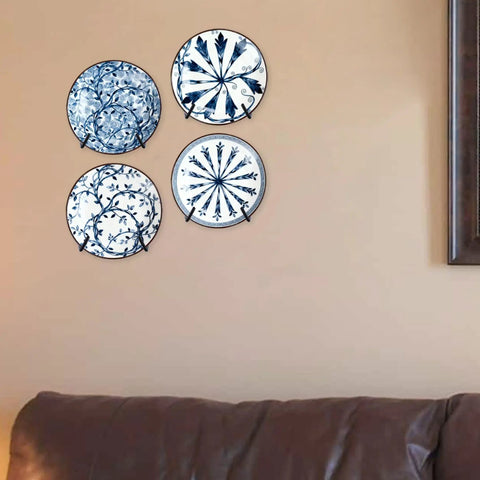Adjustable Wall Plate Hanger Display Holder For 7 To 14 Inch Plates Plaques And Artwork with four decorative plates mounted.