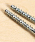 Close-up of zinc plated carbon steel flat head screws from 100 Pack M7x50mm Hex Socket Countersunk Self Tapping Screws For Heavy Duty Furniture Cabinets And Wood Projects Zinc Plated Carbon Steel Flat Head Allen Screws Kit