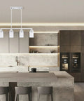 4 Light Kitchen Island Pendant Chandelier In Brushed Nickel Finish With Frosted Glass Cup Shades in a modern kitchen setting