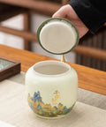 Top Shelf Ceramic Tea Tin With Woven Rattan Travel Case, Stunning Mountain Landscape Design, opening lid for loose leaf tea.