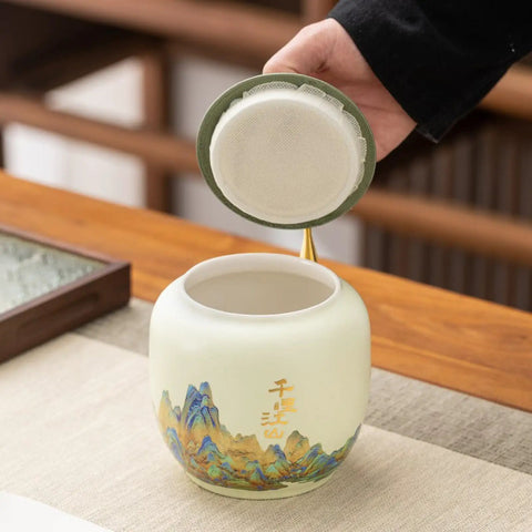 Top Shelf Ceramic Tea Tin With Woven Rattan Travel Case, Stunning Mountain Landscape Design, opening lid for loose leaf tea.