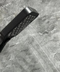 Upgrade Your Bathroom with This Matte Black Handheld Shower System - Adjustable Slide Bar & Hose High-Pressure Spray Easy-Clean Silicone Nozzles, close-up of spray nozzle.