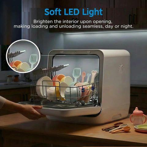 Self Contained Countertop Dishwasher With Built In Water Tank And Gentle Baby Care Mode with soft LED light illuminating dishes.