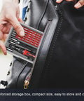 Person placing 61 In 1 Precision Screwdriver Kit With 57 Bits And Flexible Shaft Extension in a black bag