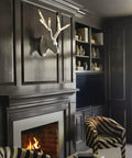 Oversized Six Light Wall Sconce In Matte Charcoal Painted Finish Killer Lodge Style Decor For Big Time Dining Room Glow, shown above fireplace.