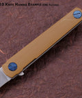 G10 knife handle example with CNC textured surface in tan, showcasing detailed craftsmanship and durable material on a knife.