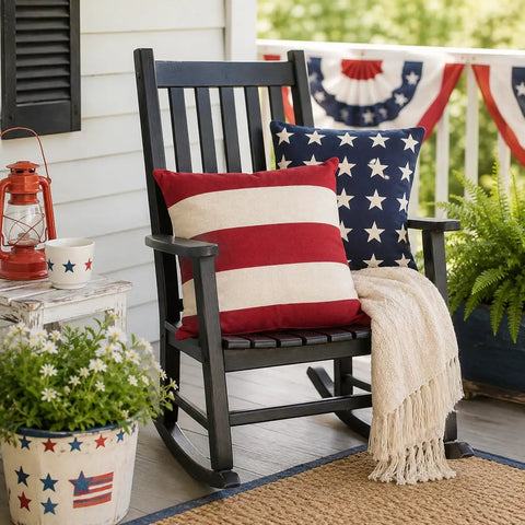 All American Patriotic Stars And Stripes Outdoor Pillow Set Of 2, Premium 14x14 Cotton Throw Pillows For 4th Of July Memorial Day And Veterans Day, Vintage Red White Blue American Flag Design For Patio Deck Or Indoor Use on a rocking chair with patriotic decor.