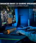 Gamer using desktop gaming monitor speakers with lit RGB lights Bluetooth soundbar 2 in 1 USB powered for immersive game sound.