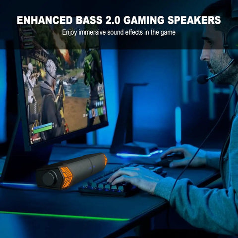 Gamer using desktop gaming monitor speakers with lit RGB lights Bluetooth soundbar 2 in 1 USB powered for immersive game sound.