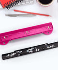 3 Hole Punch For Ring Binders With Built In Ruler, Handy Portable Paper Puncher, 5 Sheets Capacity, Deep Pink on desk