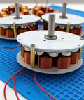 24V 50W Micro Core Disc Generator with Low RPM Performance From 100 To 650 RPM 3 Phase AC for DIY Projects on blue mat