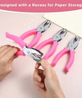 Grab And Go Four Piece One Quarter Inch Hole Punch Set With Circle Heart Star Triangle Shapes And Soft Grip Handles being used on paper