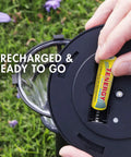 Inserting Premium Rechargeable NiMH AA Battery 1300mAh for solar garden lights, illustrating pre-charged and UL certified use